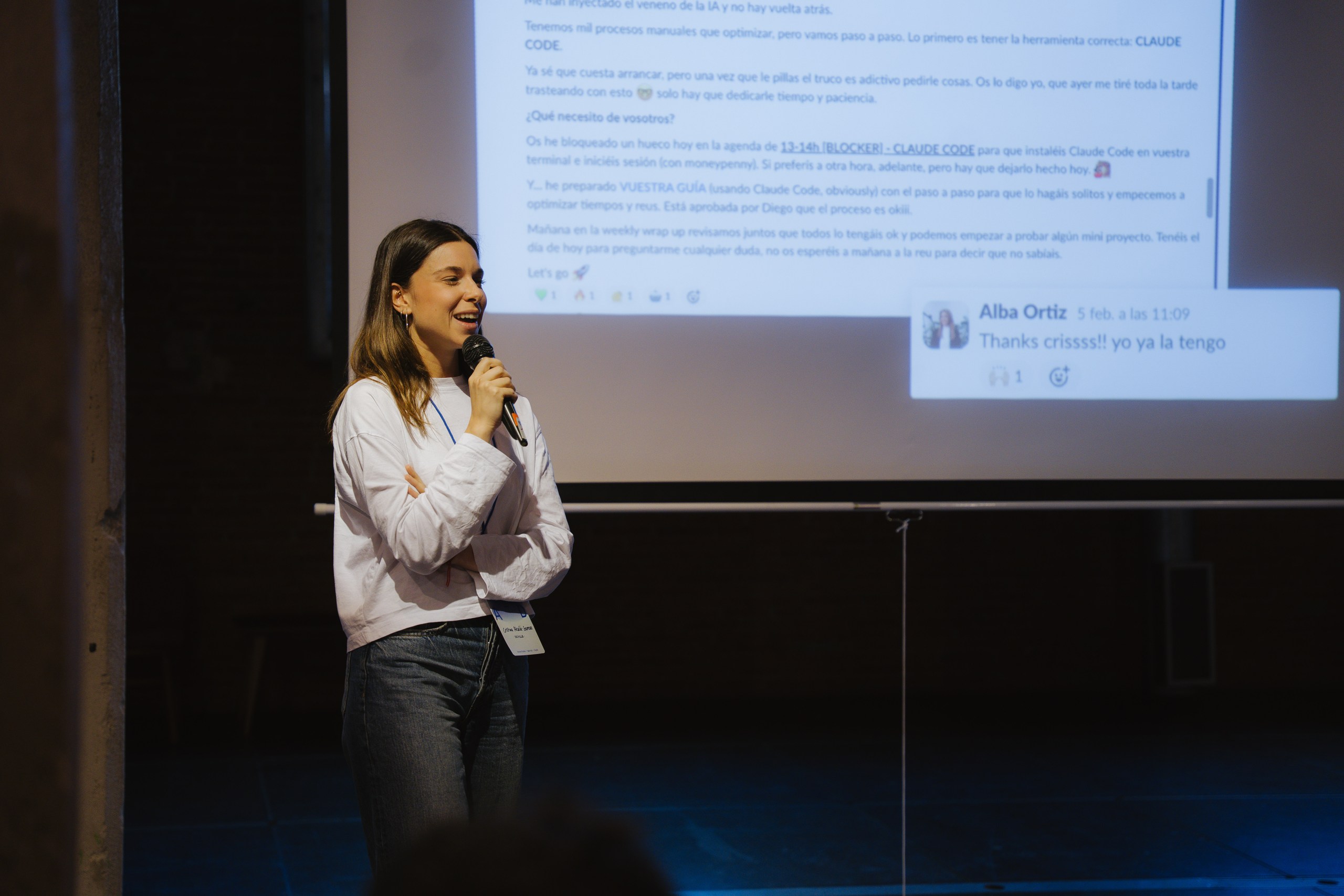 Cristina Alcalá-Zamora presenting internal Slack messages showing organic Claude Code adoption at Dcycle