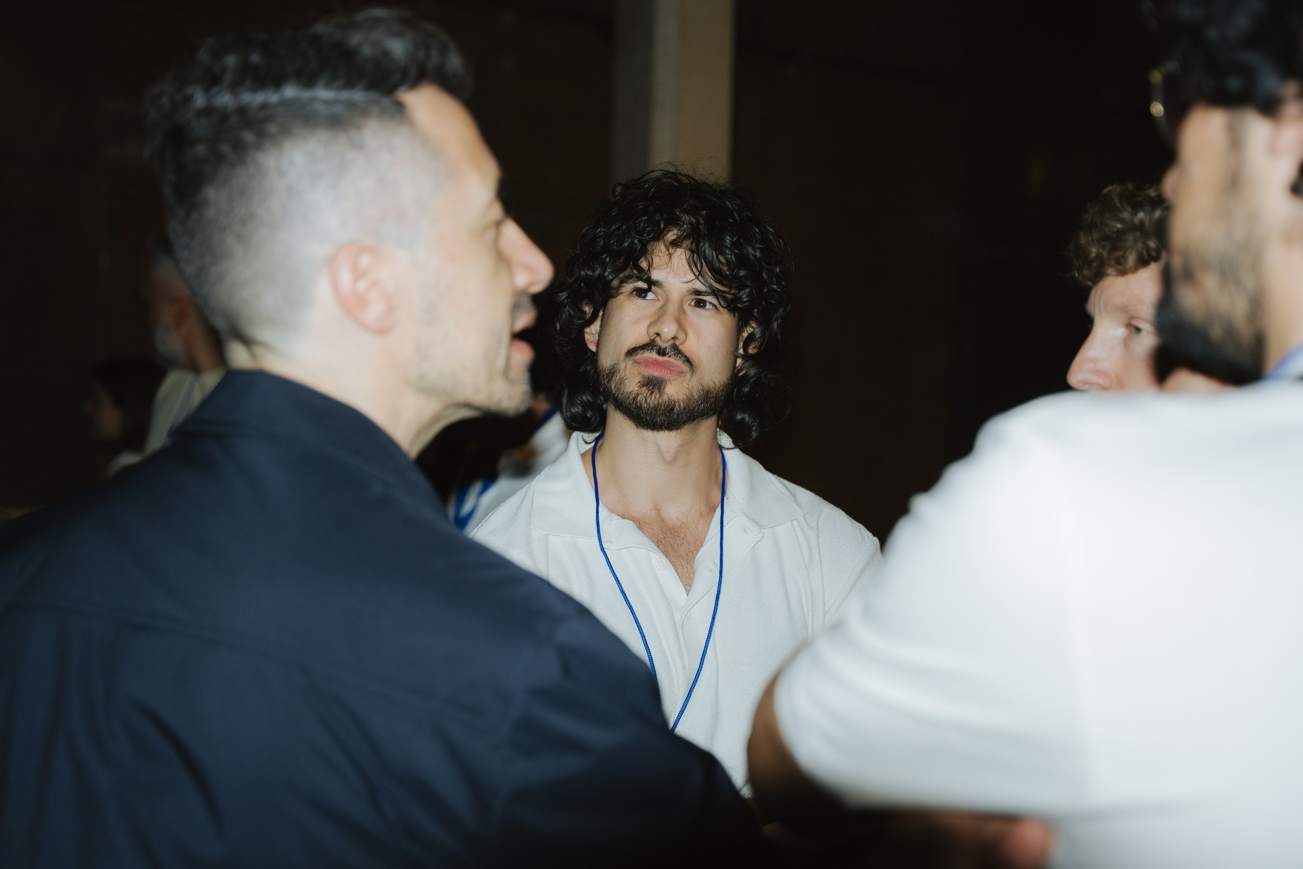 Attendees talking during the post-event networking and beers at Ahead Madrid