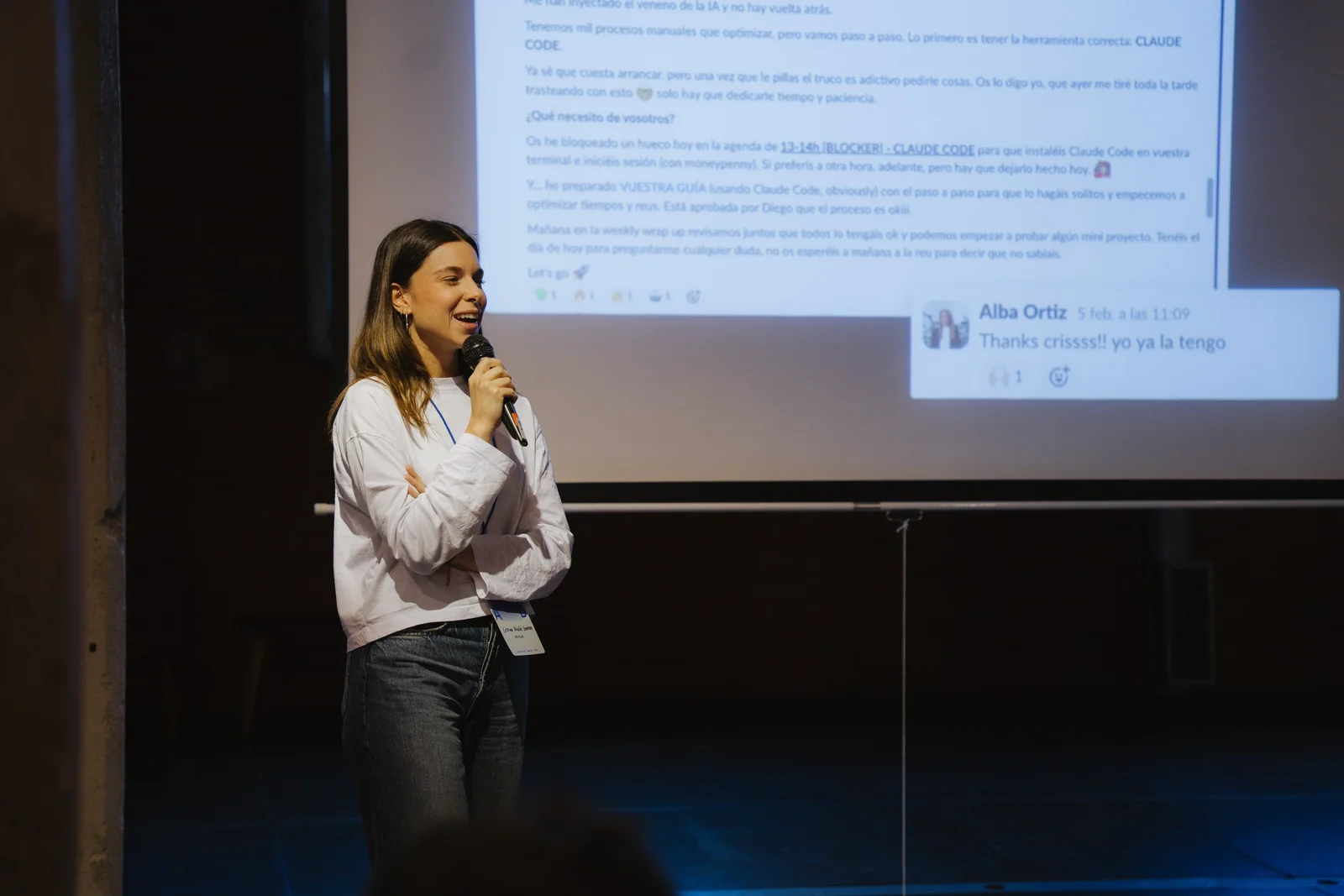 Cristina Alcalá-Zamora presenting internal Slack messages showing organic Claude Code adoption at Dcycle